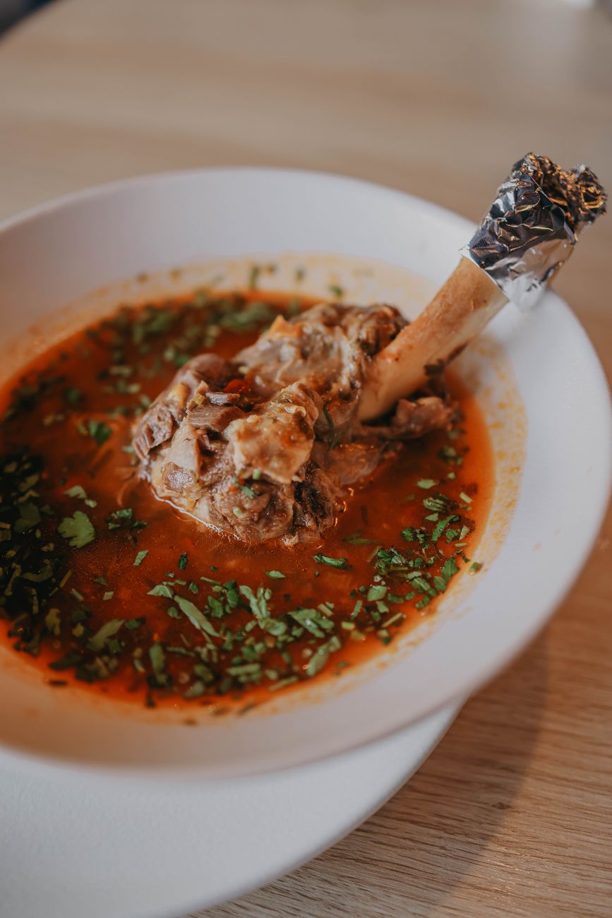 A bowl of ghormeh sabzi, the slow-cooked herb and lamb stew, served with steamed rice